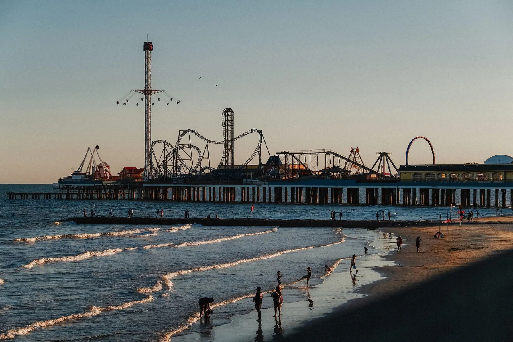 The Galveston pier and amusement rides at sunset