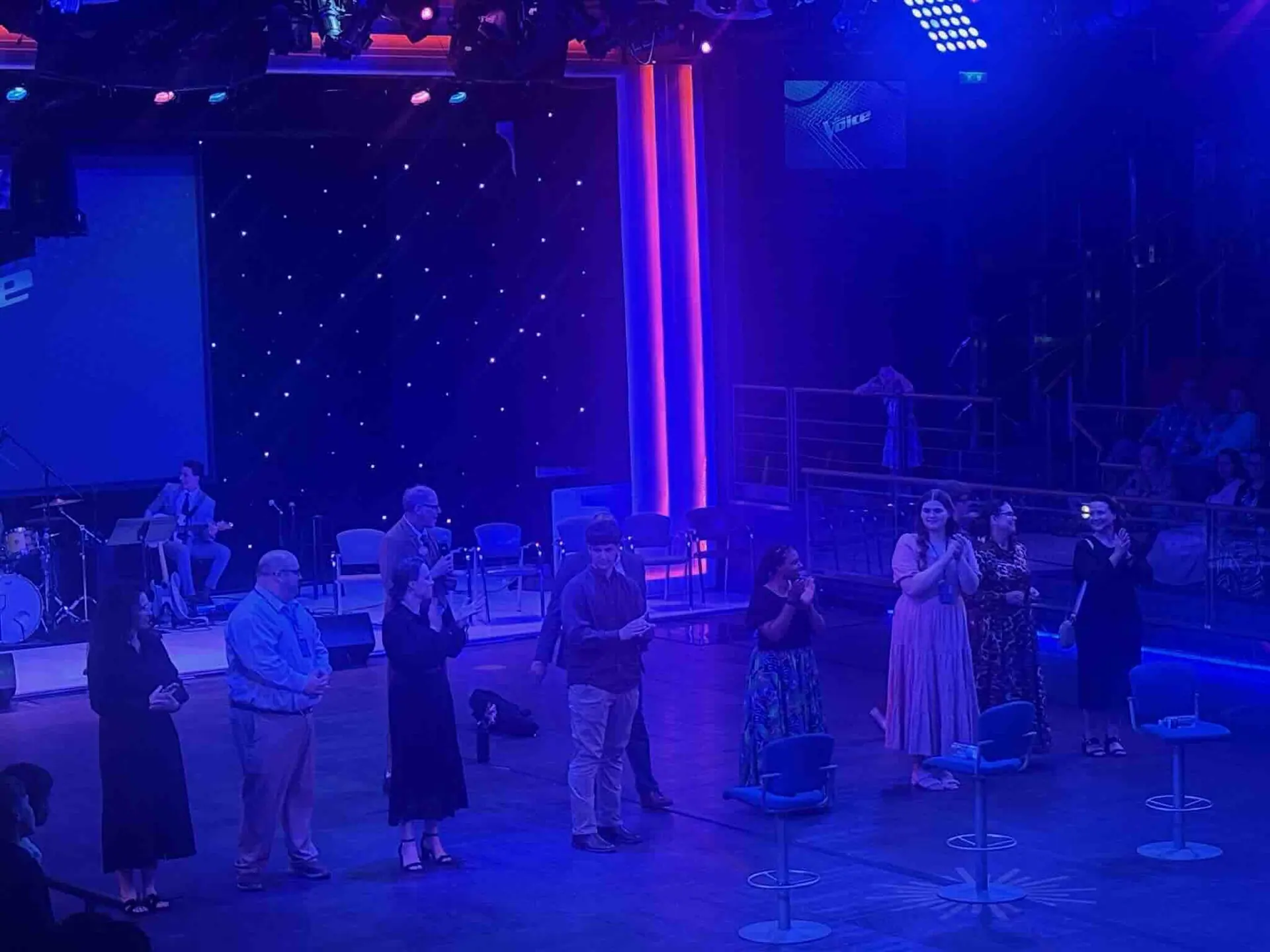 Worship in a blue-lit hall